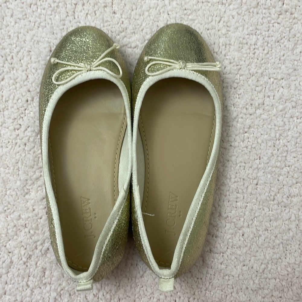 Girls’ metallic gold ballet flats